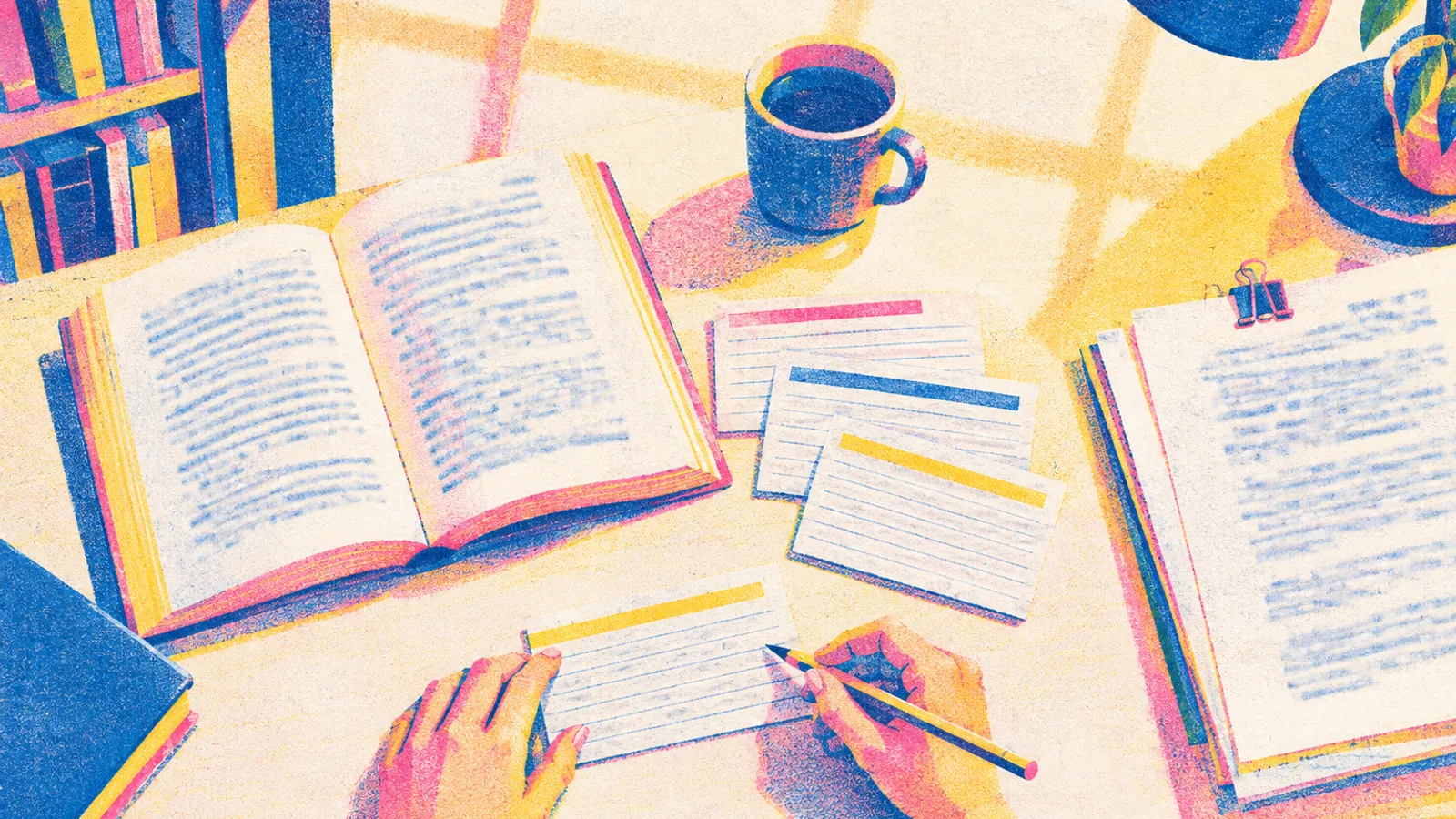 An overhead view of a library desk with an open book, colour-marked index cards, a pencil, and printed research pages.